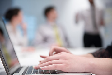 Image showing woman hands typing on laptop keyboard at business meeting