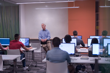 Image showing teacher and students in computer lab classroom