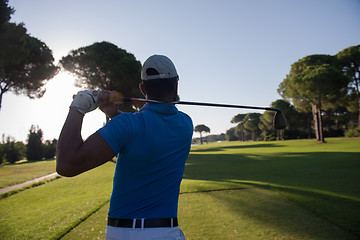 Image showing golf player hitting shot