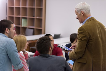 Image showing teacher with a group of students in classroom