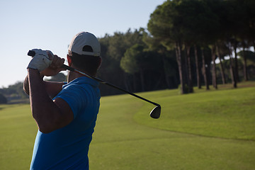 Image showing golf player hitting shot