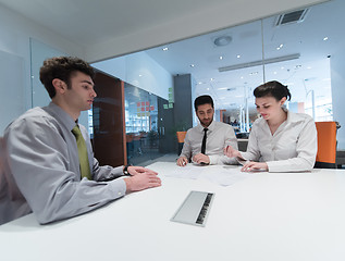 Image showing young couple signing contract documents on partners back