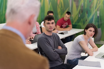 Image showing teacher with a group of students in classroom