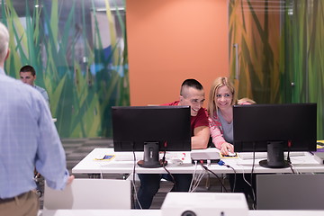 Image showing teacher and students in computer lab classroom