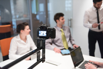 Image showing business people group brainstorming and taking notes to flip boa