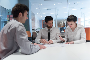 Image showing young couple signing contract documents on partners back