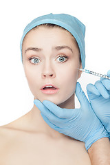 Image showing Attractive woman at plastic surgery with syringe in her face