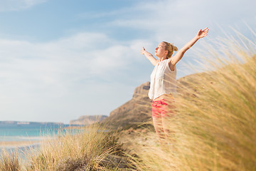 Image showing Free Happy Woman Enjoying Sun on Vacations.