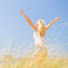 Image showing Free Happy Woman Enjoying Sun on Vacations.