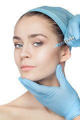 Image showing Attractive woman at plastic surgery with syringe in her face