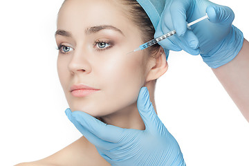 Image showing Attractive woman at plastic surgery with syringe in her face