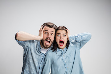 Image showing Close up photo of angry man and woman touching their heads