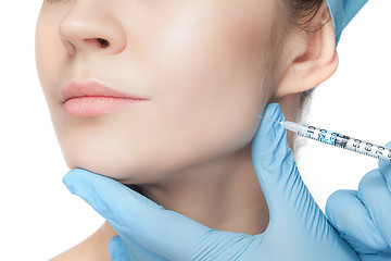 Image showing Attractive woman at plastic surgery with syringe in her face