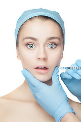 Image showing Attractive woman at plastic surgery with syringe in her face