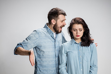 Image showing The young couple with different emotions during conflict