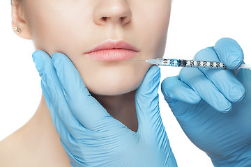 Image showing Attractive woman at plastic surgery with syringe in her face