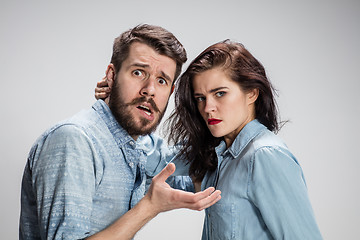 Image showing The young couple with different emotions during conflict