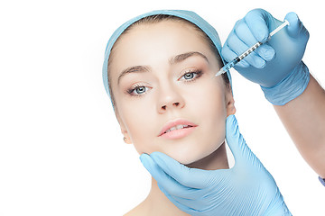 Image showing Attractive woman at plastic surgery with syringe in her face