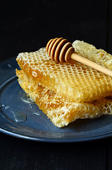 Image showing  honeycomb and wooden dipper