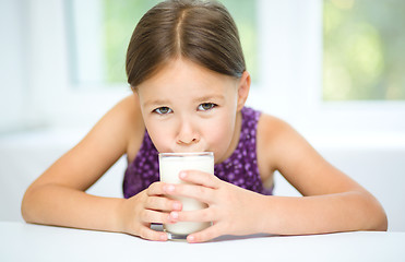 Image showing Little girl with a glass of milk