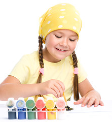 Image showing Cute cheerful child play with paints