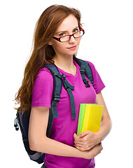 Image showing Young student girl is holding book