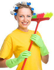 Image showing Young woman with broom - cleaning concept