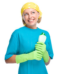 Image showing Young woman with cleaning liquid