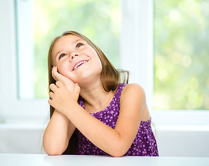 Image showing Little girl is daydreaming