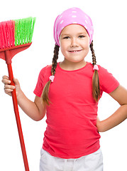 Image showing Young girl is dressed as a cleaning maid