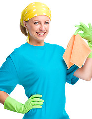 Image showing Young woman holding cleaning rag