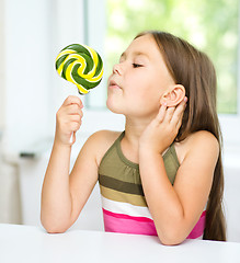 Image showing Little girl with lollipop