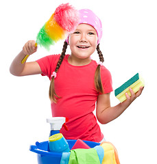 Image showing Young girl is dressed as a cleaning maid