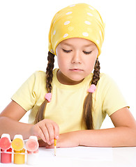 Image showing Cute thoughtful child play with paints