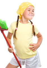 Image showing Young girl is dressed as a cleaning maid