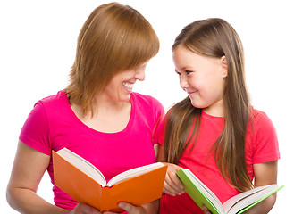 Image showing Mother and her daughter are reading books