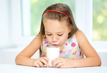 Image showing Little girl with a glass of milk