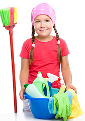 Image showing Young girl is dressed as a cleaning maid