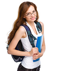 Image showing Young student girl is holding book