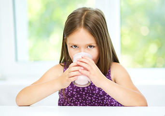 Image showing Little girl with a glass of milk