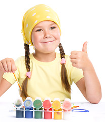 Image showing Cute cheerful child play with paints