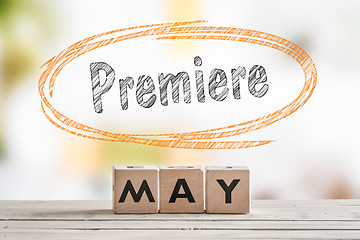 Image showing May premiere sign on a wooden table