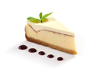 Image showing cheesecake slice decorated with mint leaf