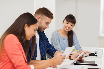 Image showing happy creative team or students working at office