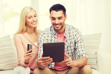 Image showing happy couple with tablet pc and credit card