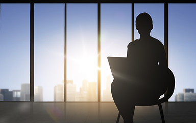 Image showing silhouette of business woman with laptop