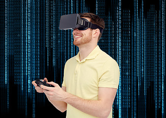 Image showing happy man in virtual reality headset with gamepad