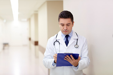 Image showing doctor with clipboard at hospital corridor
