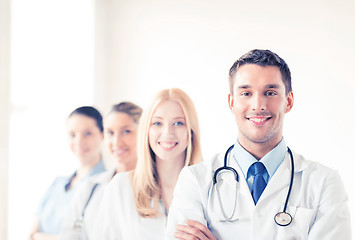 Image showing male doctor in front of medical group