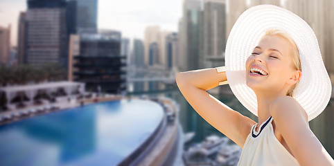 Image showing happy woman enjoying summer over dubai city